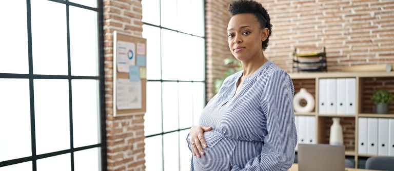 pregnant woman holding belly